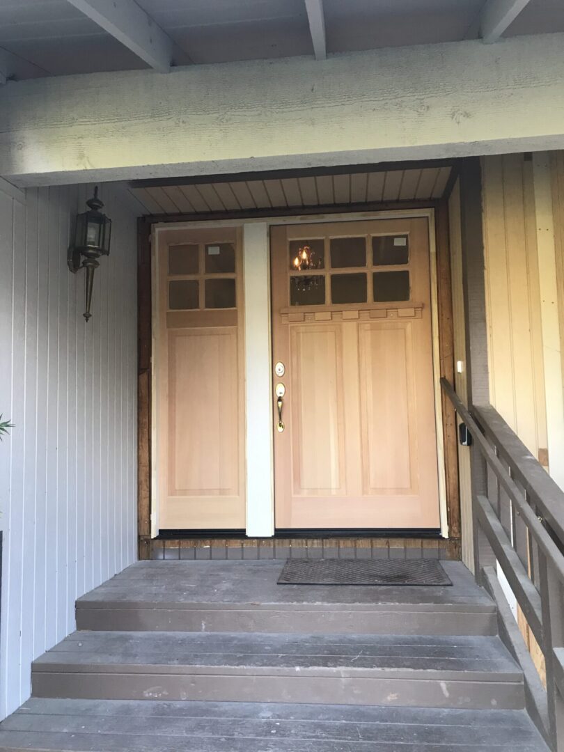 A front door of a house with two doors.